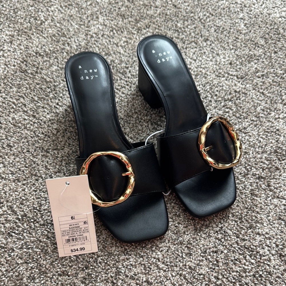A New Day Black and Gold Mules with Sleek Design